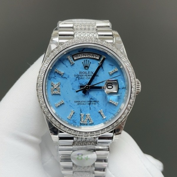 Sunday Calendar series women's watch, turquoise dial, diamond-set bezel, 36mm, diamond-set silver President-style bracelet.